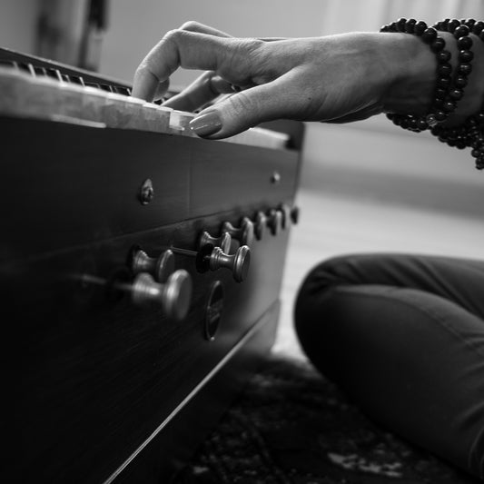 Bhava Studio Harmonium being played, image in black and white